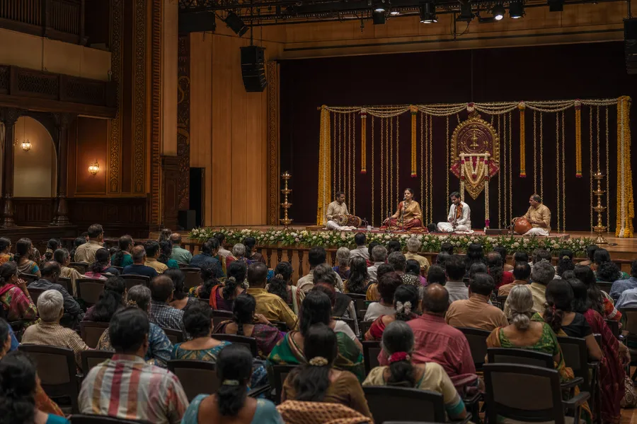 Carnatic music ensemble performing in a grand Chennai auditorium during December Season